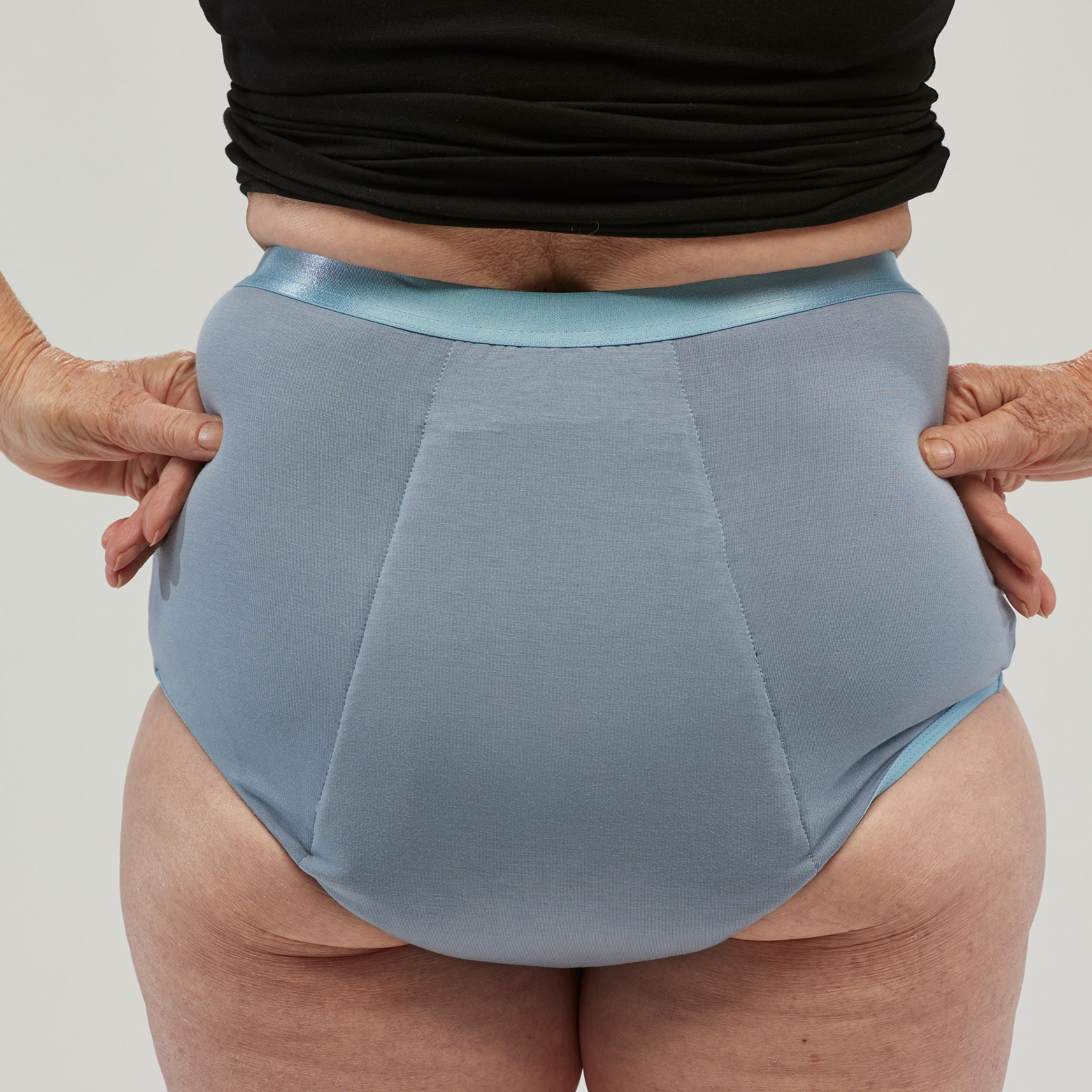 Back view of StayDry women's full brief underwear in blue, designed for waterproof incontinence protection. Featuring a high-waisted fit and soft, breathable fabric for all-day comfort and confidence.