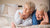 elderly couple happily lounging in their adjustable or hospital bed