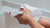 hands using wet wipes