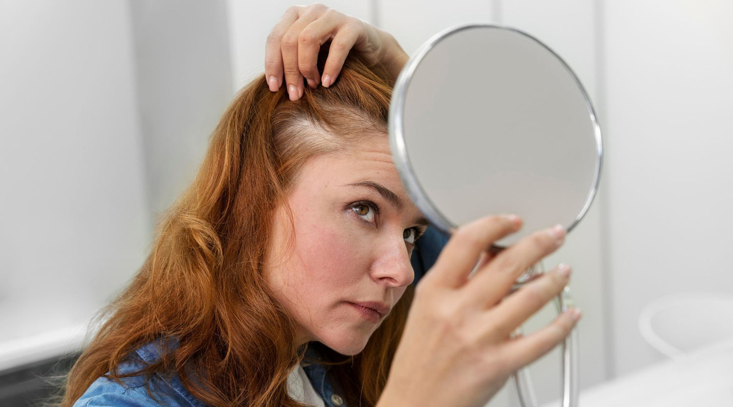 woman looking at the mirror for her eczema on the scalp