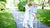 nurse-helping-senior-woman-use-walking-frame