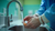 Close-up of Caucasian hands rinsing a feeding tube under a stream of water in a stainless steel sink in a modern hospital setting, bright overhead lighting, sterile environment