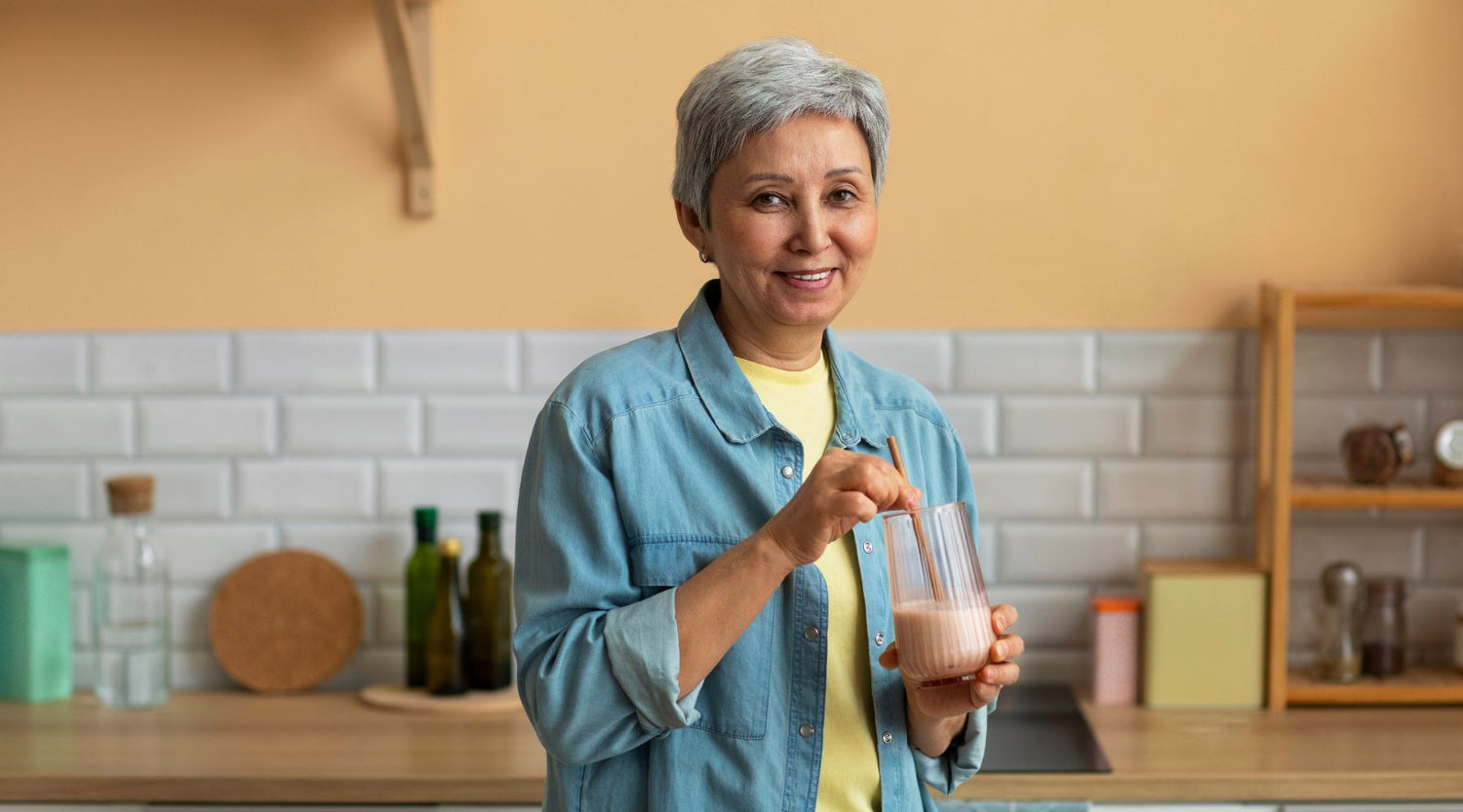 elderly woman drinking fortisip from a glass