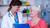 elderly person speaking to her doctor