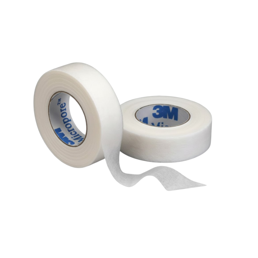 Two rolls of white 3M Micropore paper surgical tape on a black background, with the tape brand visible on the core of the roll on the left.