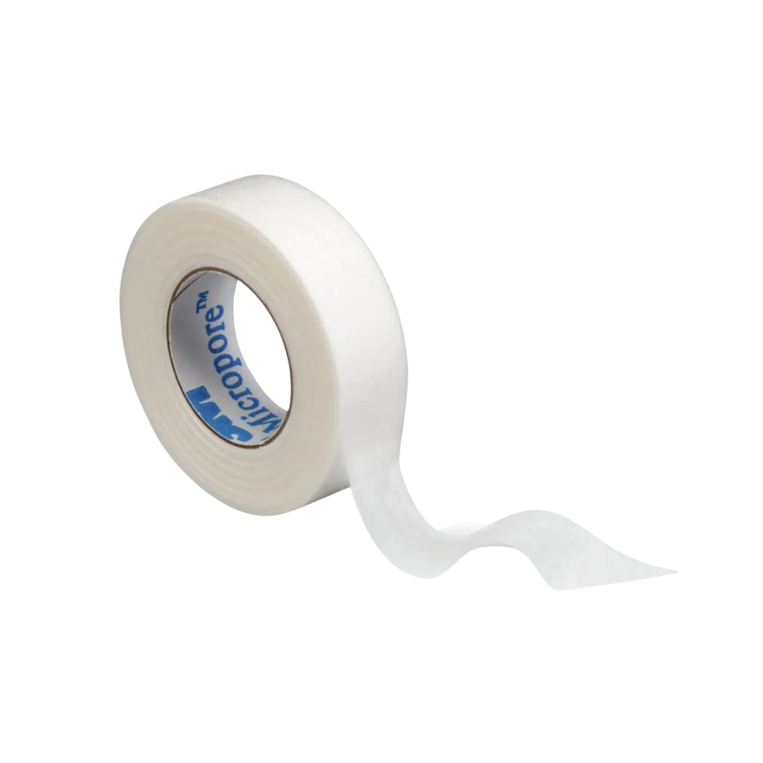 A single roll of white 3M Micropore medical tape, unrolling slightly to show the breathable paper texture, on a black background.