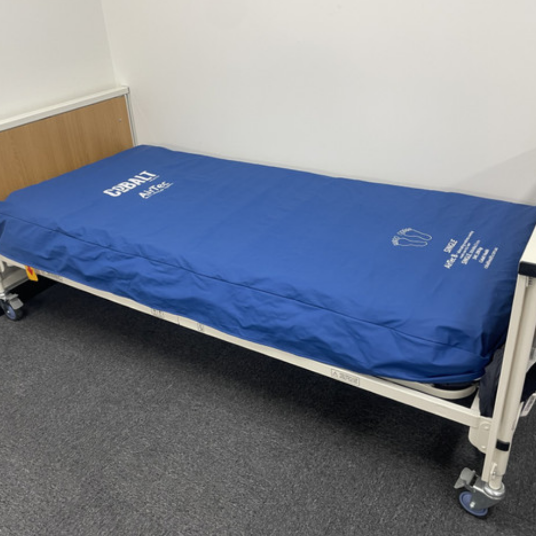 AirTec 8 Mattress Replacement System displayed on a bed frame, featuring deep air cells designed to deliver advanced alternating pressure relief for high‑risk users.