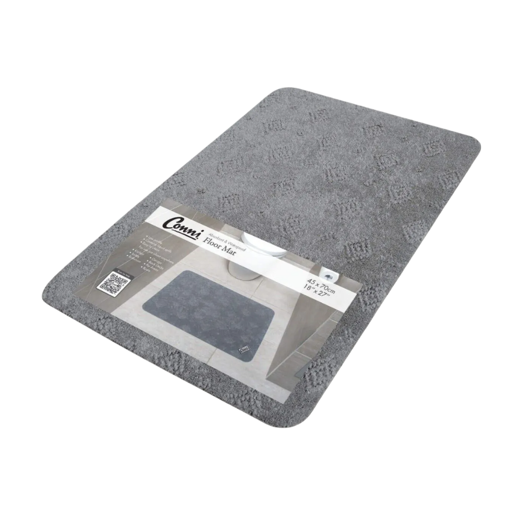 Conni Compact Floor Mat with absorbent fabric top and waterproof, non-slip backing, designed for incontinence and spill protection in residential and aged care environments.