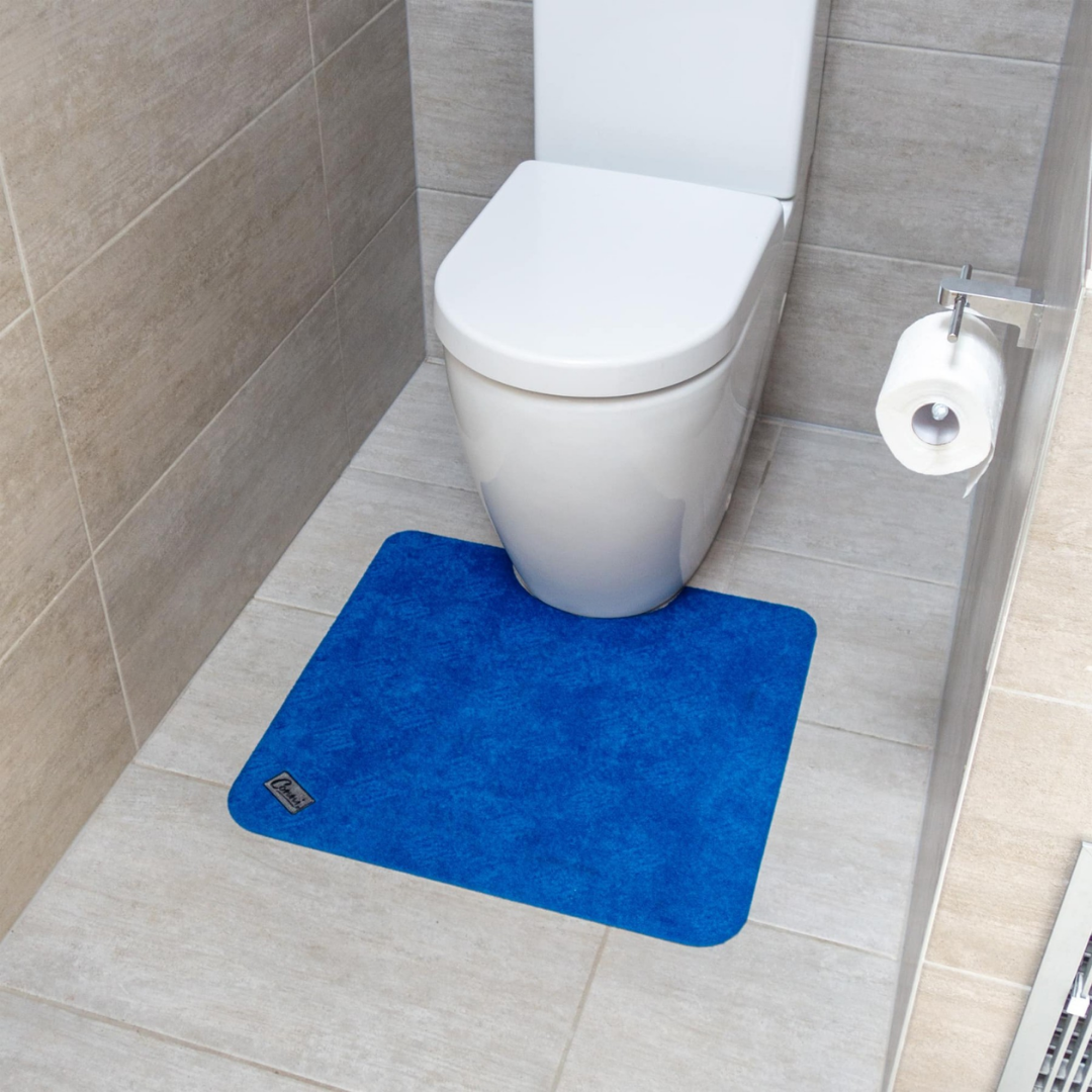 Conni Toilet Floor Mat in multiple colours, absorbent and non-slip, designed for continence care, aged care, NDIS participants, and home bathroom safety.