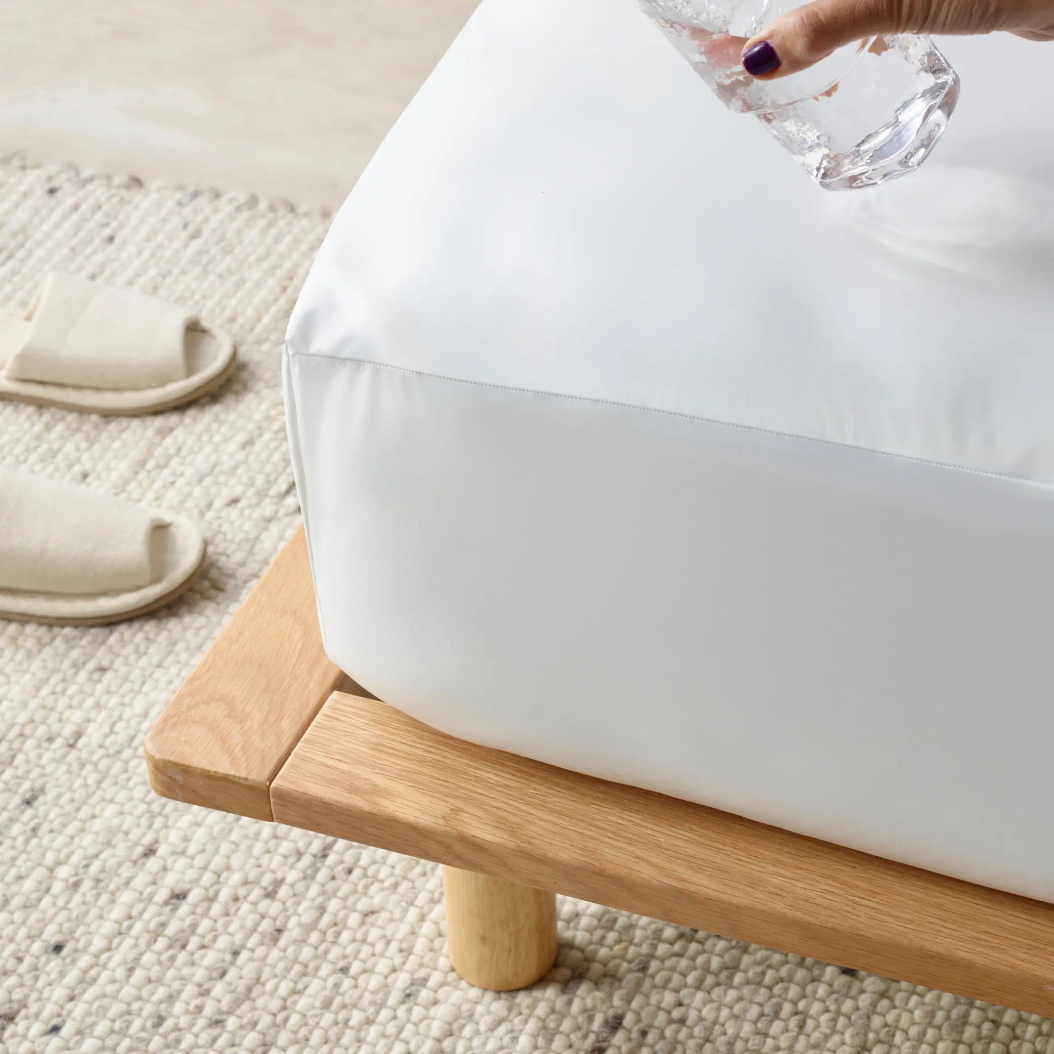 Close-up of the Duratherme Waterproof Mattress Protector demonstrating its liquid-resistant surface. Designed for ultimate mattress protection