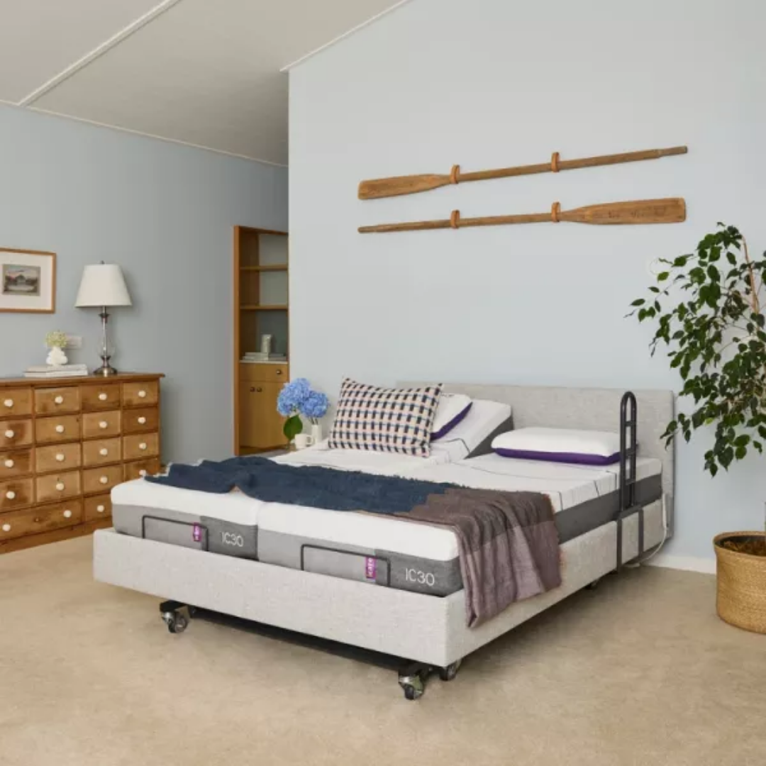 Icare IC333 Homecare Bed shown with adjustable backrest and leg rest, featuring upholstered finish and ultra-low height for safe mobility.