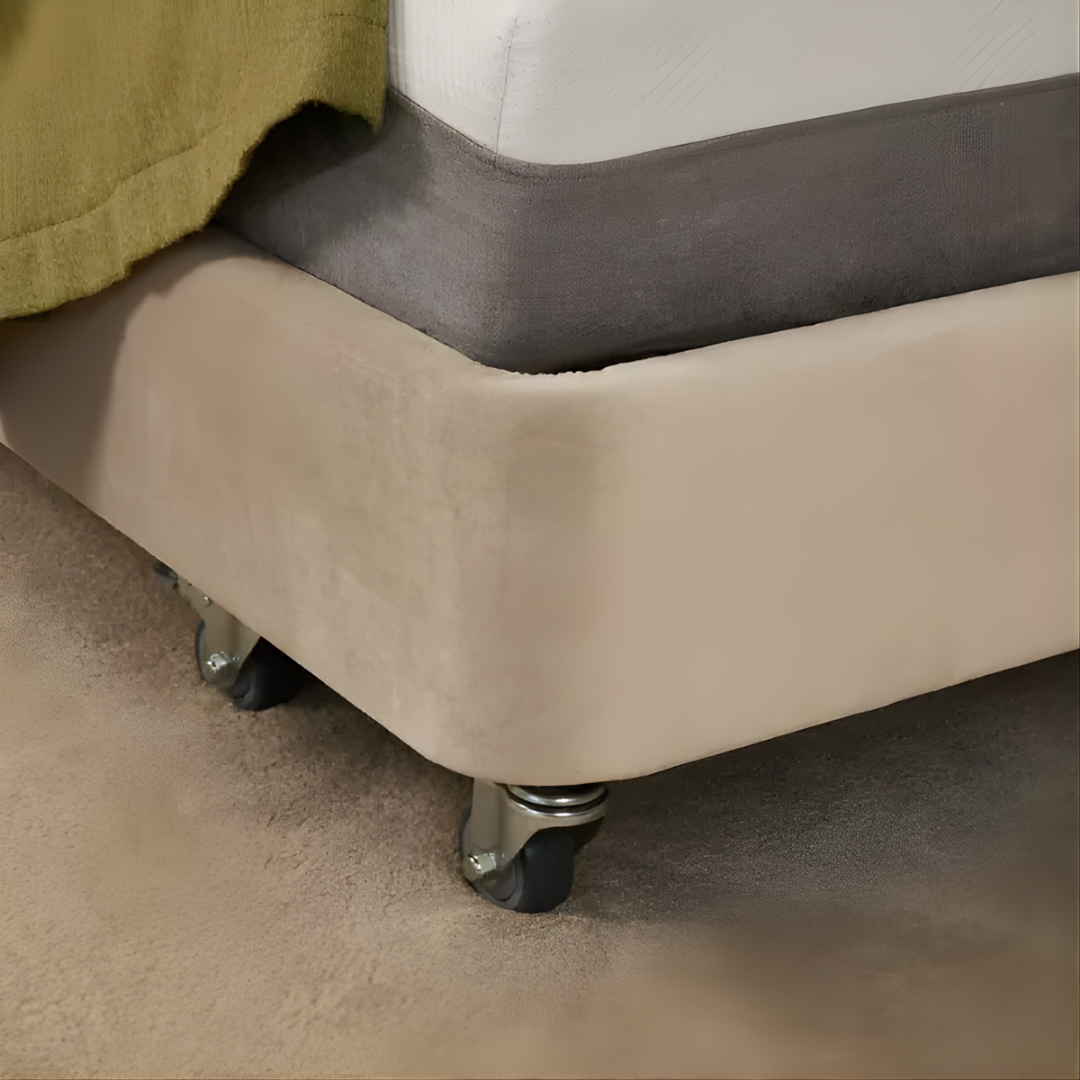 Icare IC333 Homecare Bed shown with adjustable backrest and leg rest, featuring upholstered finish and ultra-low height for safe mobility.