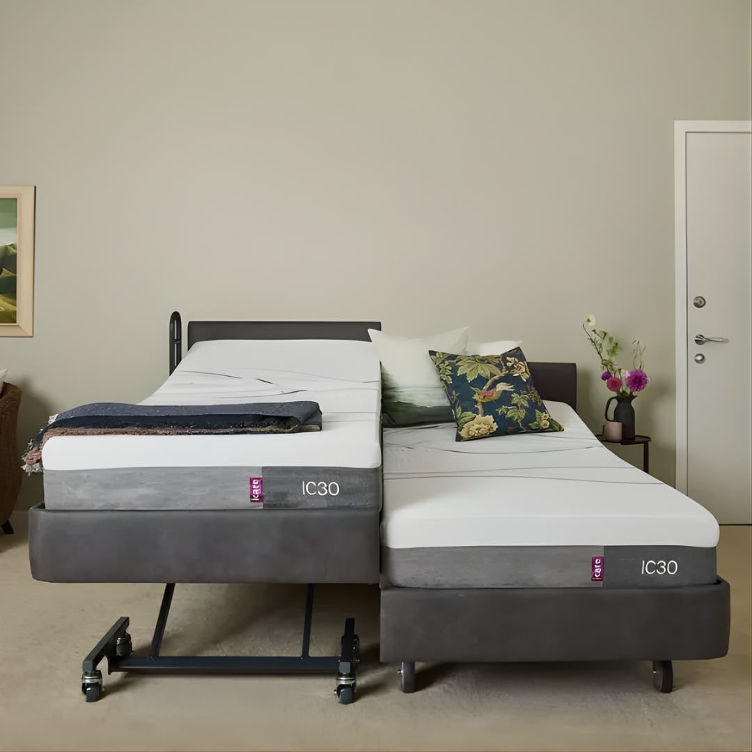 Icare IC333 Homecare Bed shown with adjustable backrest and leg rest, featuring upholstered finish and ultra-low height for safe mobility.