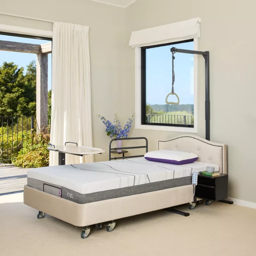 Icare IC333 Homecare Bed shown with adjustable backrest and leg rest, featuring upholstered finish and ultra-low height for safe mobility.