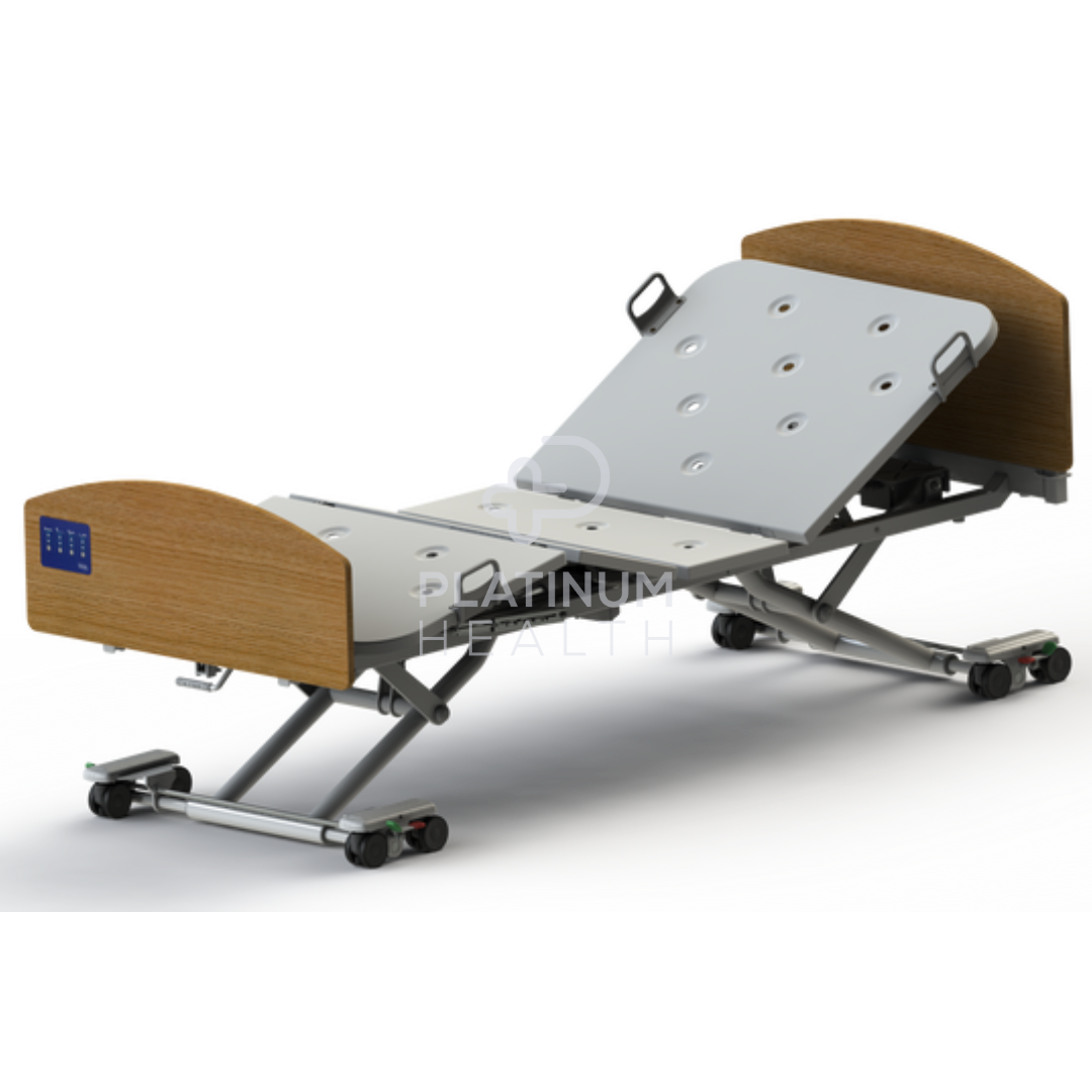 Invacare CS8 Floorline Bed elevated for easy caregiver access and customizable positioning