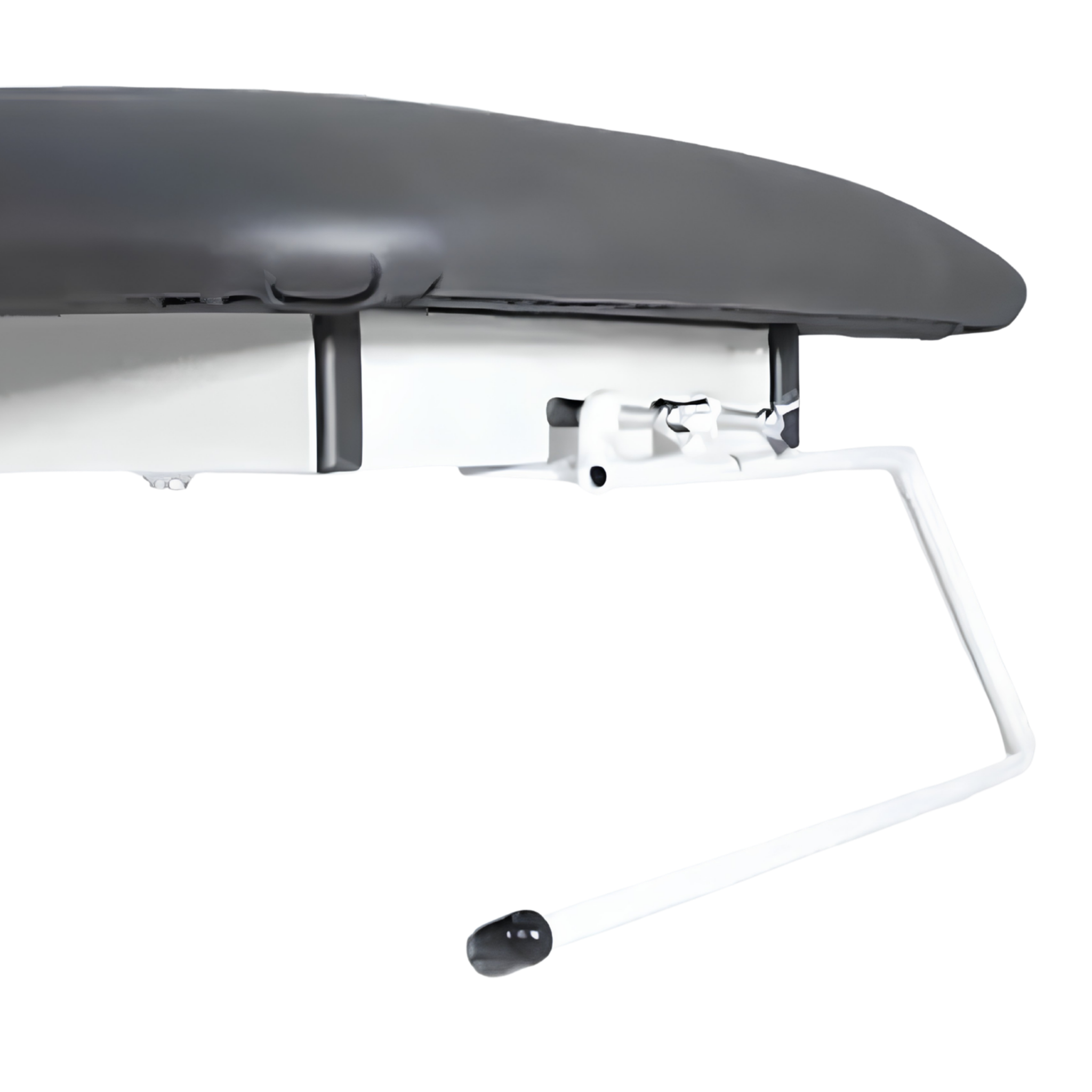 Close-up of a paper towel holder attachment mounted to the frame of a treatment couch.