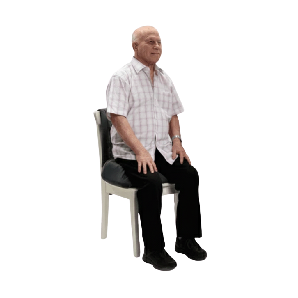 Man sitting on a chair with a cushion on a white background