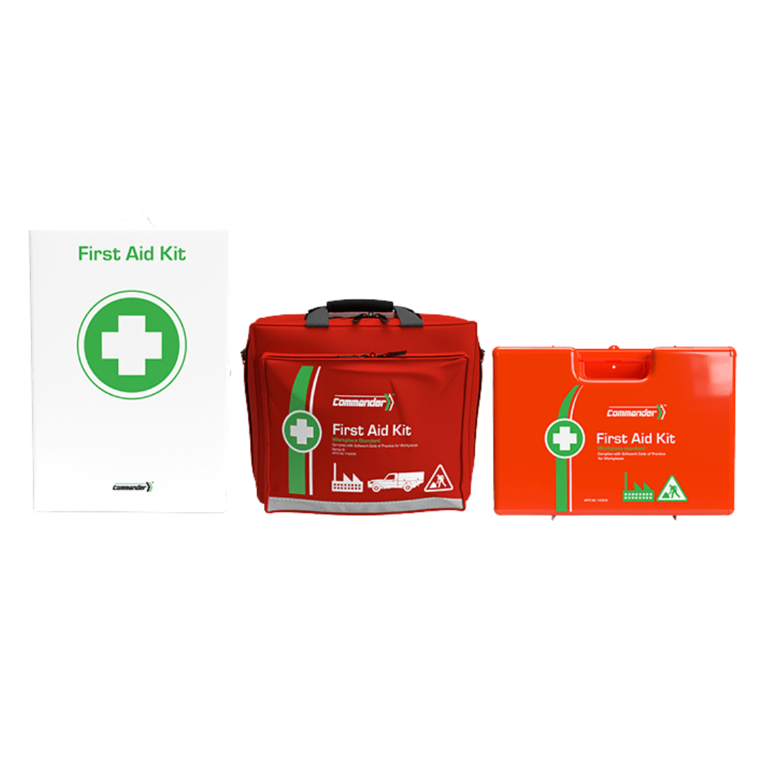 A wide array of medical supplies from the Commander First Aid Kit laid out on a surface, with the orange case centered in the background (Refill contents are implicitly part of this collection).