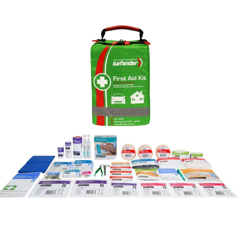 A product image showing the contents of the Defender 3 Series Softpack First Aid Kit laid out on a dark background. The green softpack bag is centered, surrounded by items including rolls of bandages, small liquid bottles or ampoules, a pair of scissors, a booklet, and various packaged wound dressings.