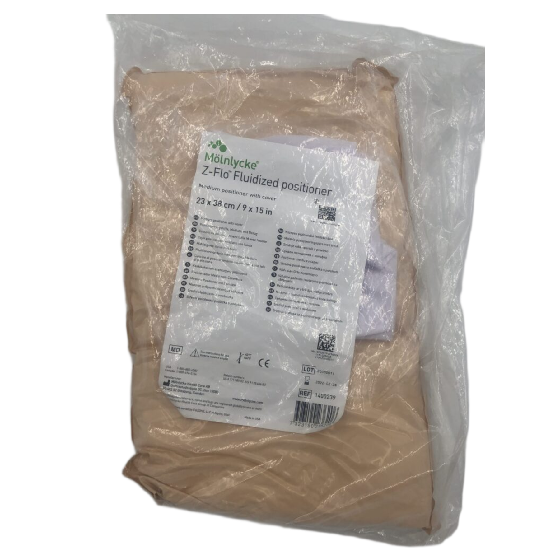 A medium-sized Mölnlycke Z-Flo Fluidized positioner, measuring 23x38cm, sealed in protective clear plastic packaging with detailed product information on the label.