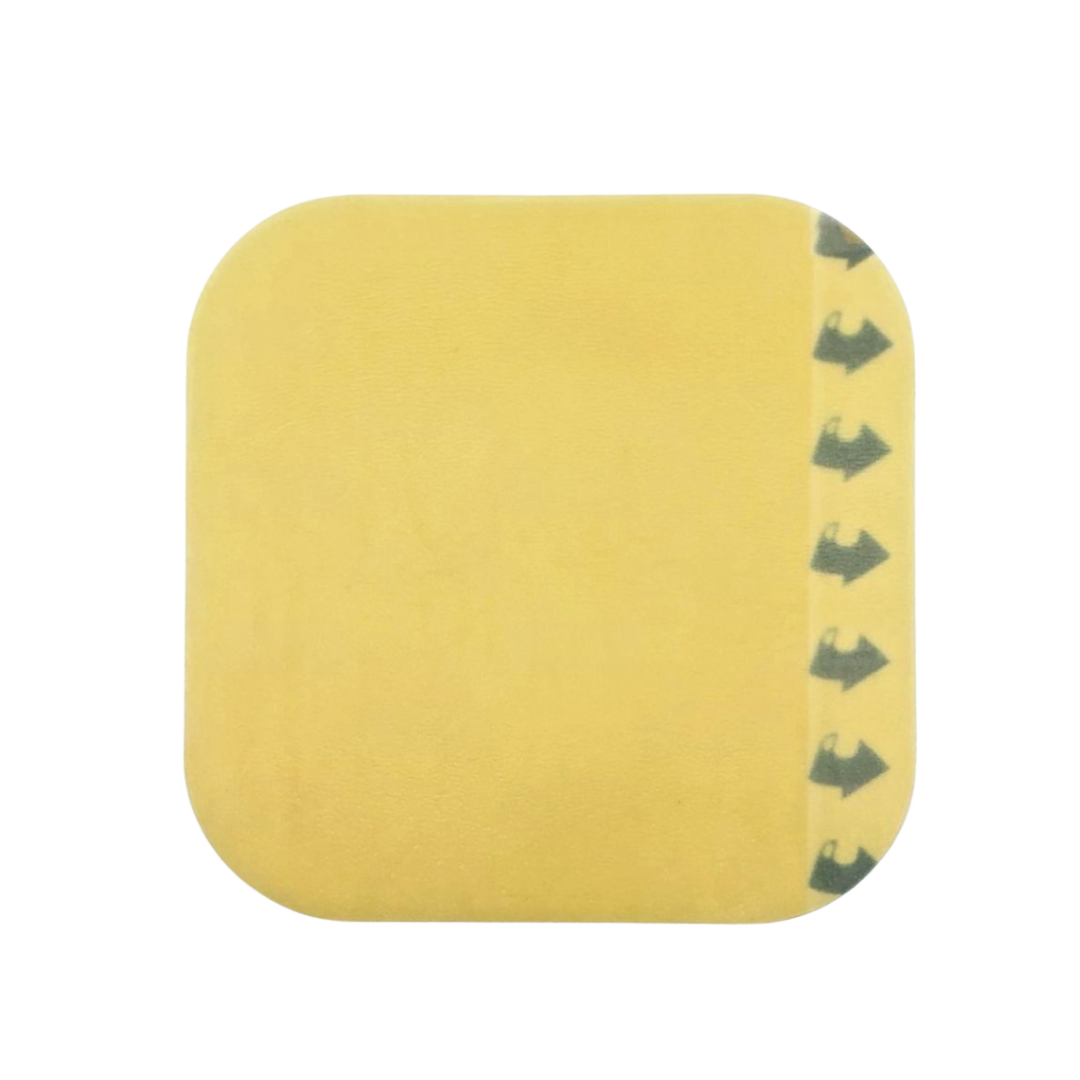 Close-up of OsmoCol® Hydrocolloid Dressing (Standard), size 10cm x 10cm, featuring smooth beige surface and printed arrows for easy application. Ideal for promoting moist wound healing.
