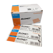 Box of Jelonet Paraffin Gauze Dressing ($5 \times 5 \text{ cm}$) resting on top of several individual sterile sachets of the product.